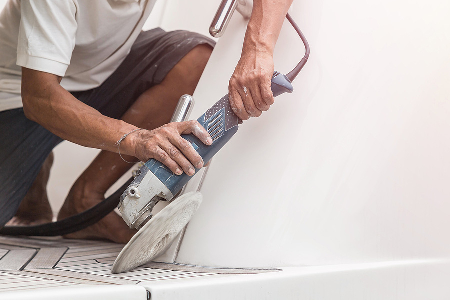 man polishing yacht interior